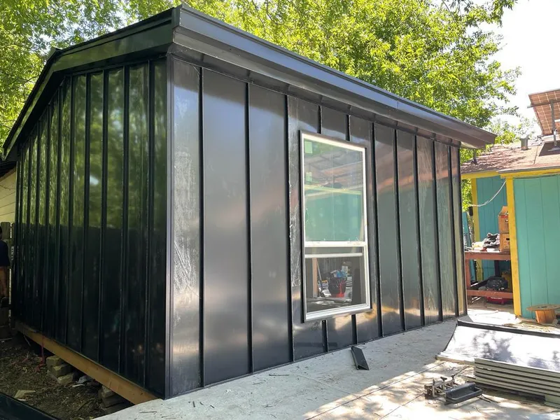 Black standing seam metal wall panels for Roof Inspection in North Arlington