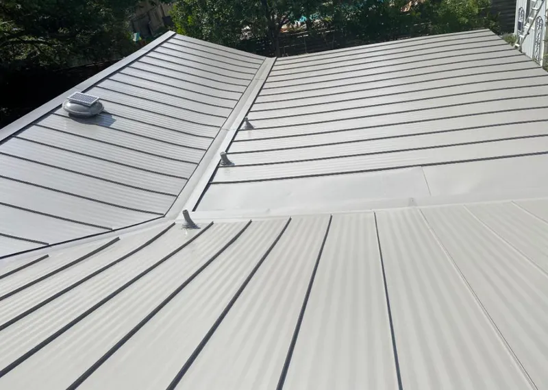 Solar attic fan installed on a metal roof for Roof Ventilation in North Arlington
